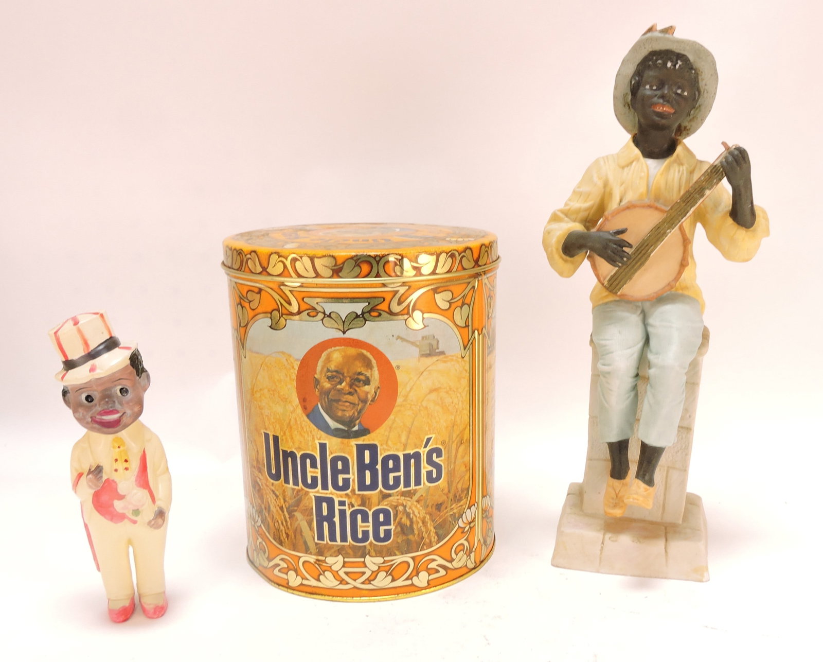 Black Americana Ben's Rice tin,: bisque figural, and rattle, various condition