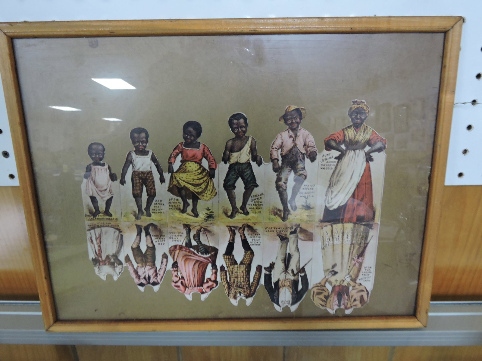 Black Americana frame of paper dolls: .