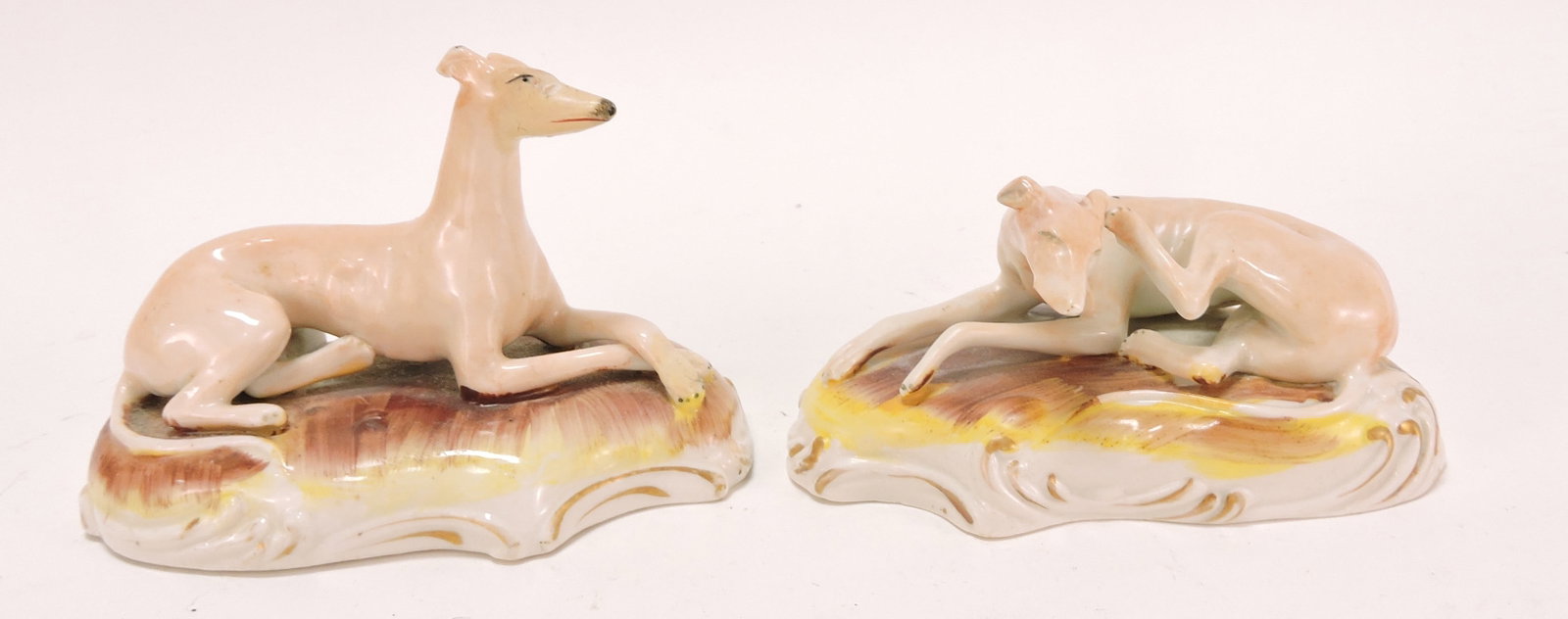 Staffordshire pair of recumbent dogs: .