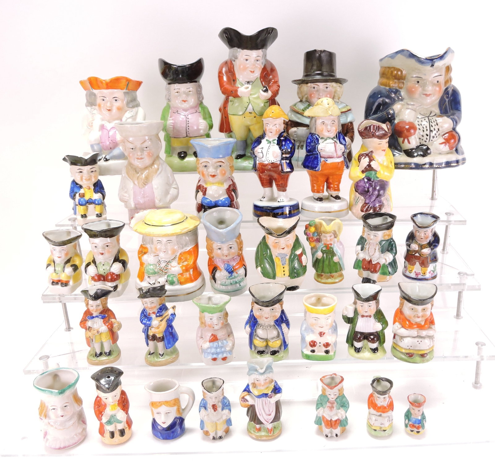 Staffordshire and other lot of toby jugs,: 1 1/2" to 7"