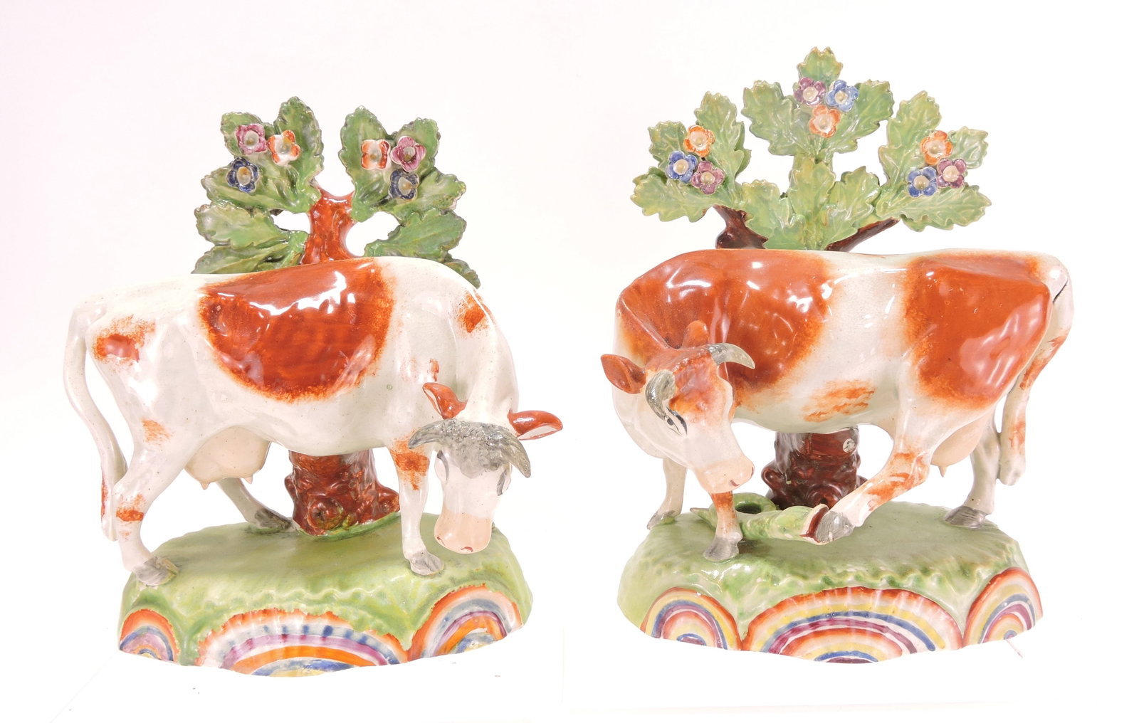 Staffordshire pair of cow figures with: bocage, 7"