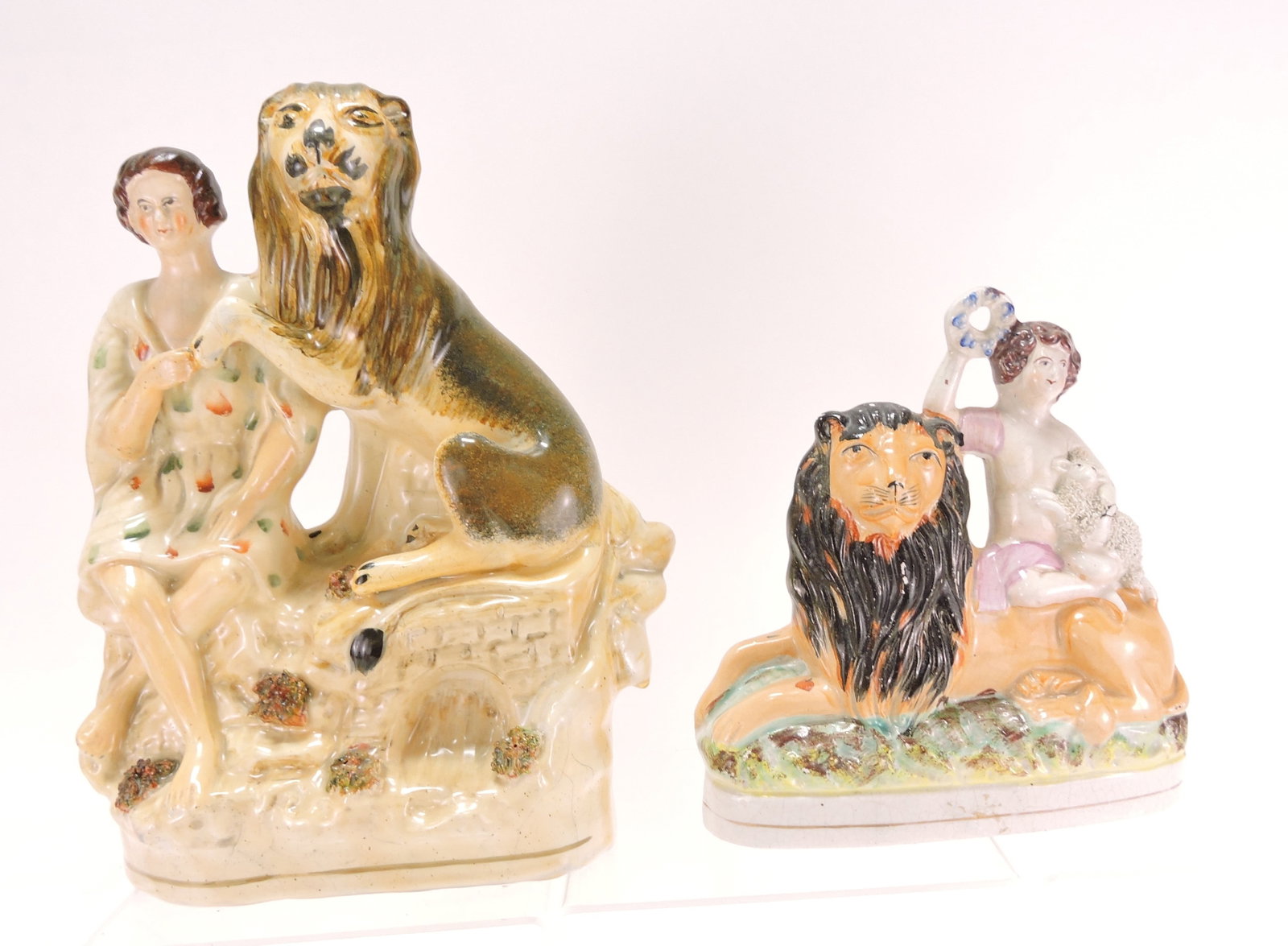 Staffordshire lot of 2 lion figures,: 7" & 11"