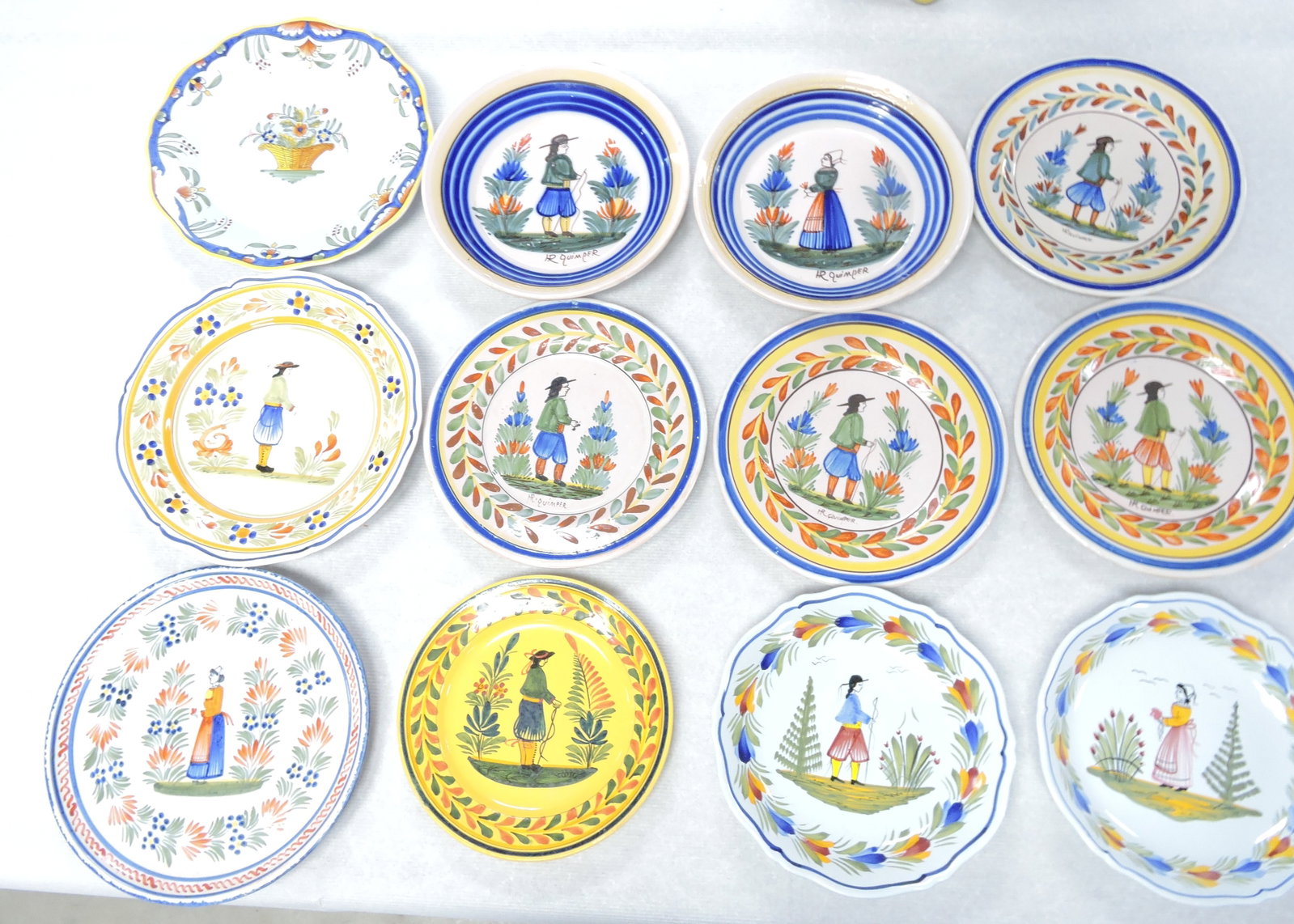 Quimper lot of 12 plates, 8" to 10": .