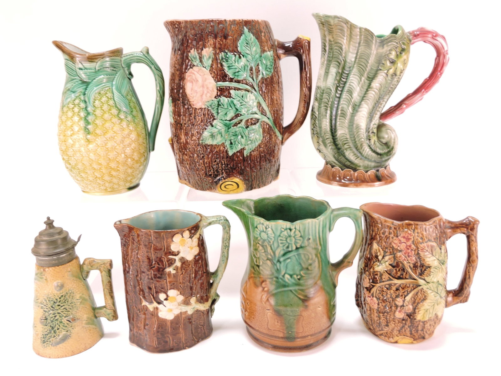 Majolica lot of 7 pitchers, 6" to 9",: various condition