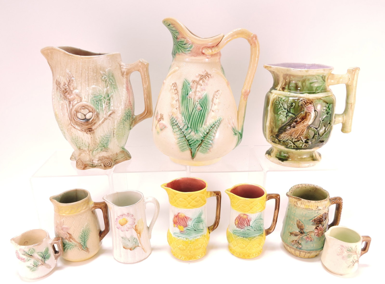 Majolica lot of 10 pitchers and creamers,: 3" to 11", various condition