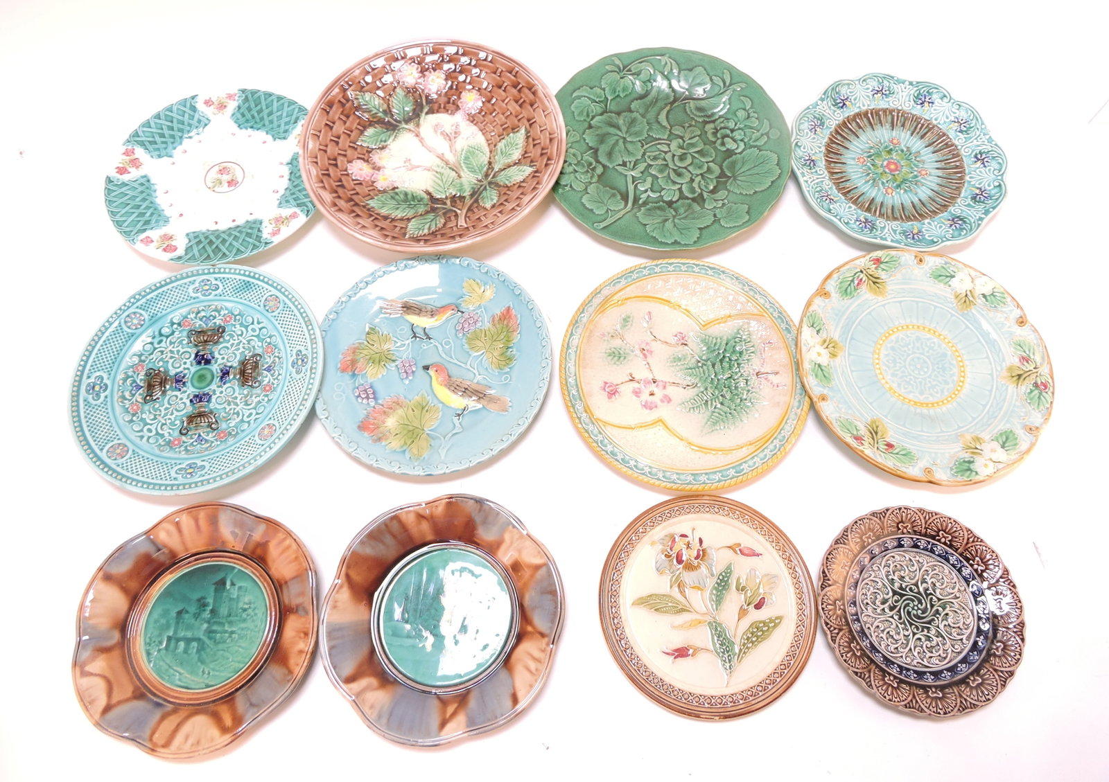Majolica lot of 12 plates, 5" to 9",: various condition