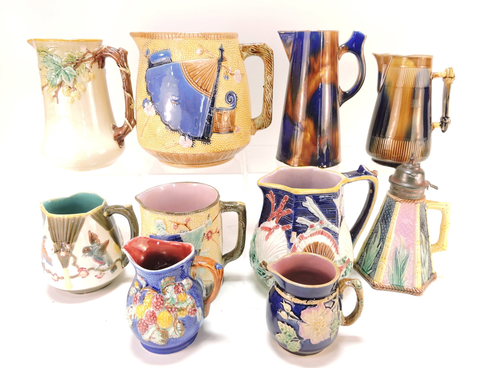 Majolica lot of 10 pitchers, 4" to 8": .