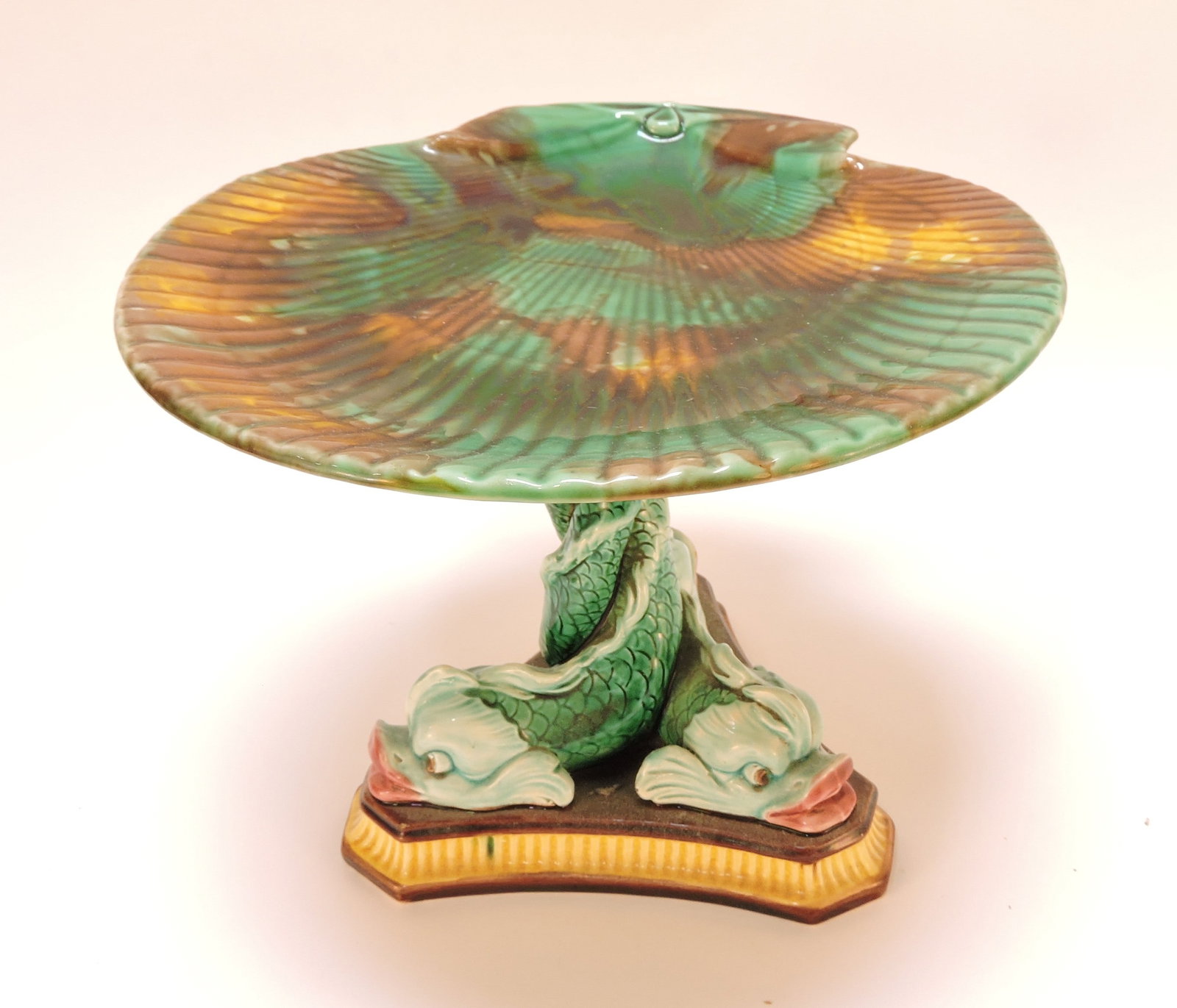 Wedgwood majolica shell compote: with three intertwined dolphin base, 7"h, 9"w