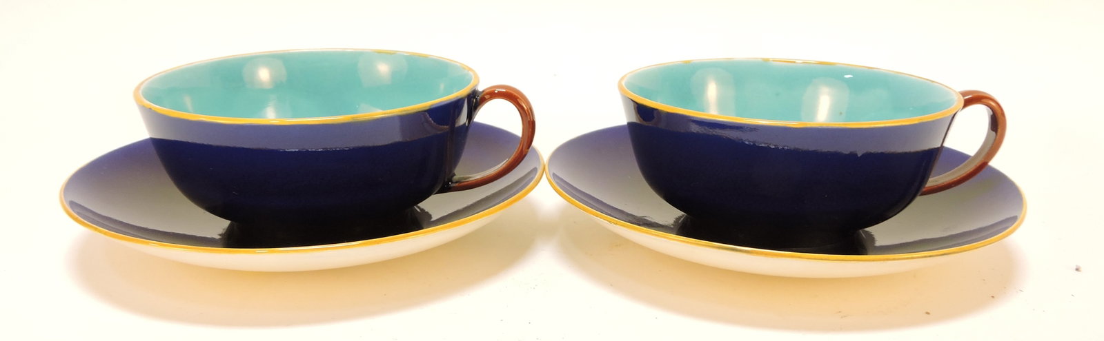 Wedgwood cobalt majolica pair of cups: and saucers