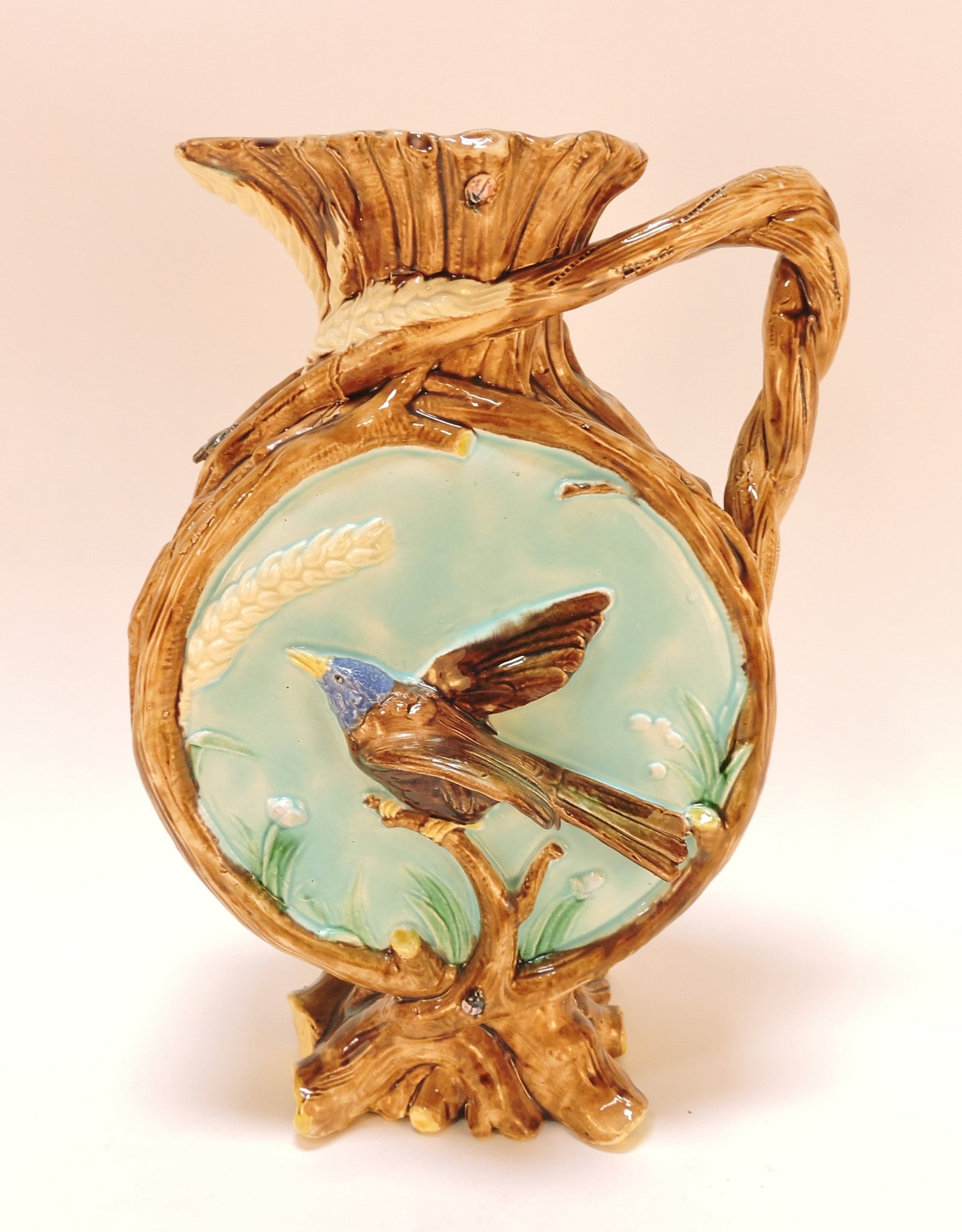 Majolica pitcher with birds, twigs, (1 of 2)
