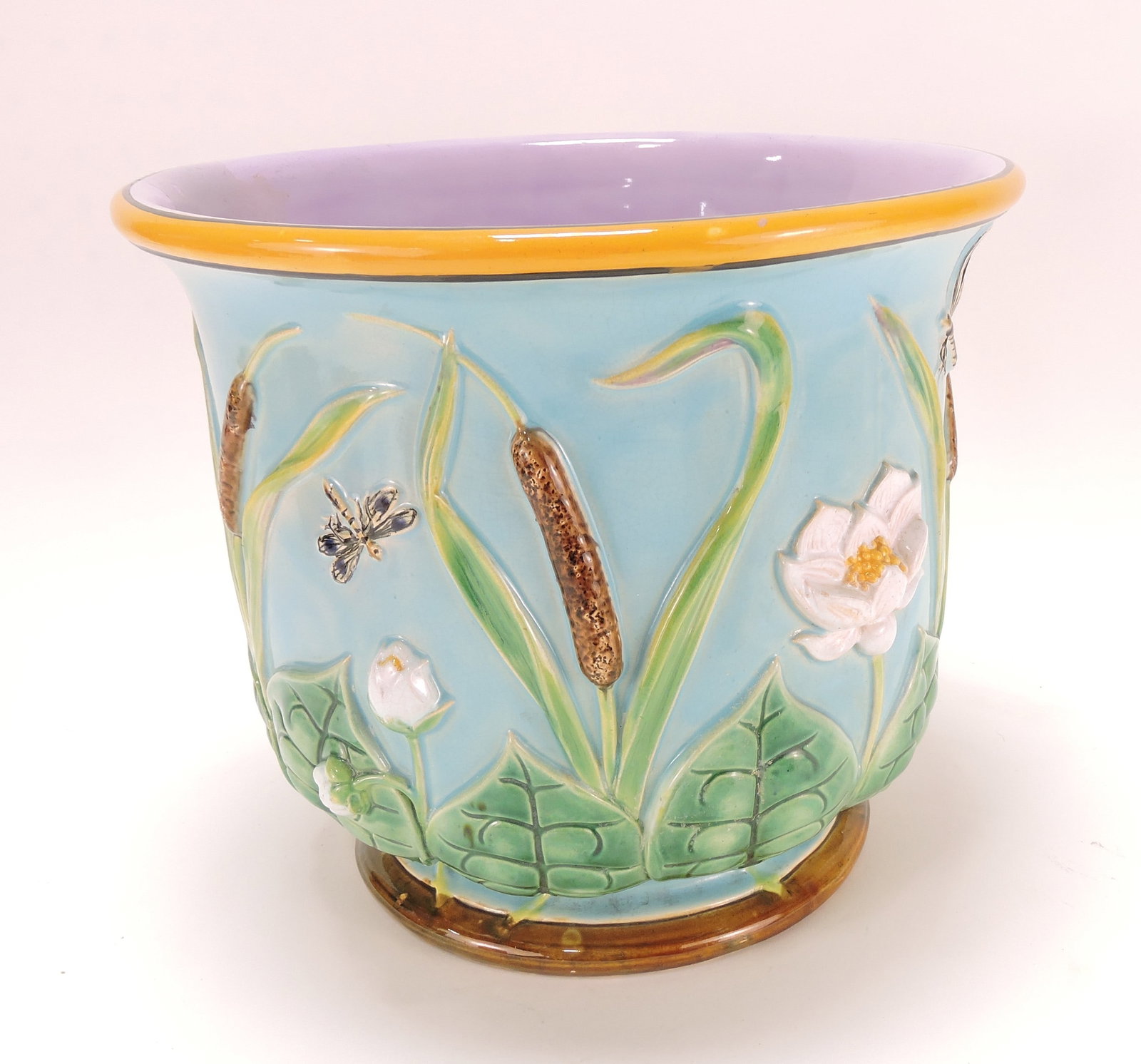 George Jones turquoise majolica: dragonfly, water lily, and cattail jardiniere, 10"h, professional hairline repair