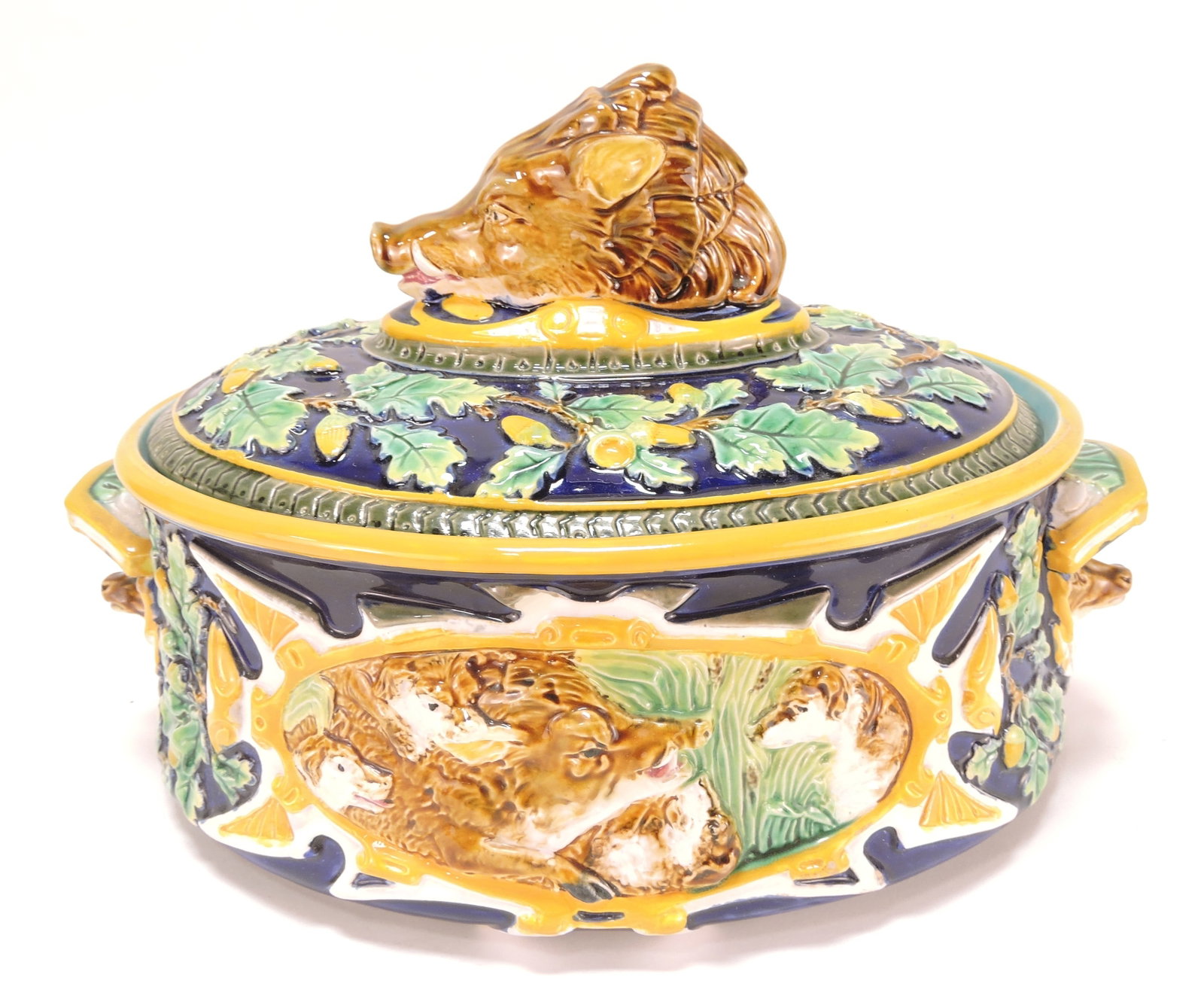 Geroge Jones rare cobalt majolica boar's: head game dish with stag handles, base with dogs chasing wild boar, rare color, professional repair to boar's ear, 8"h, 12"w