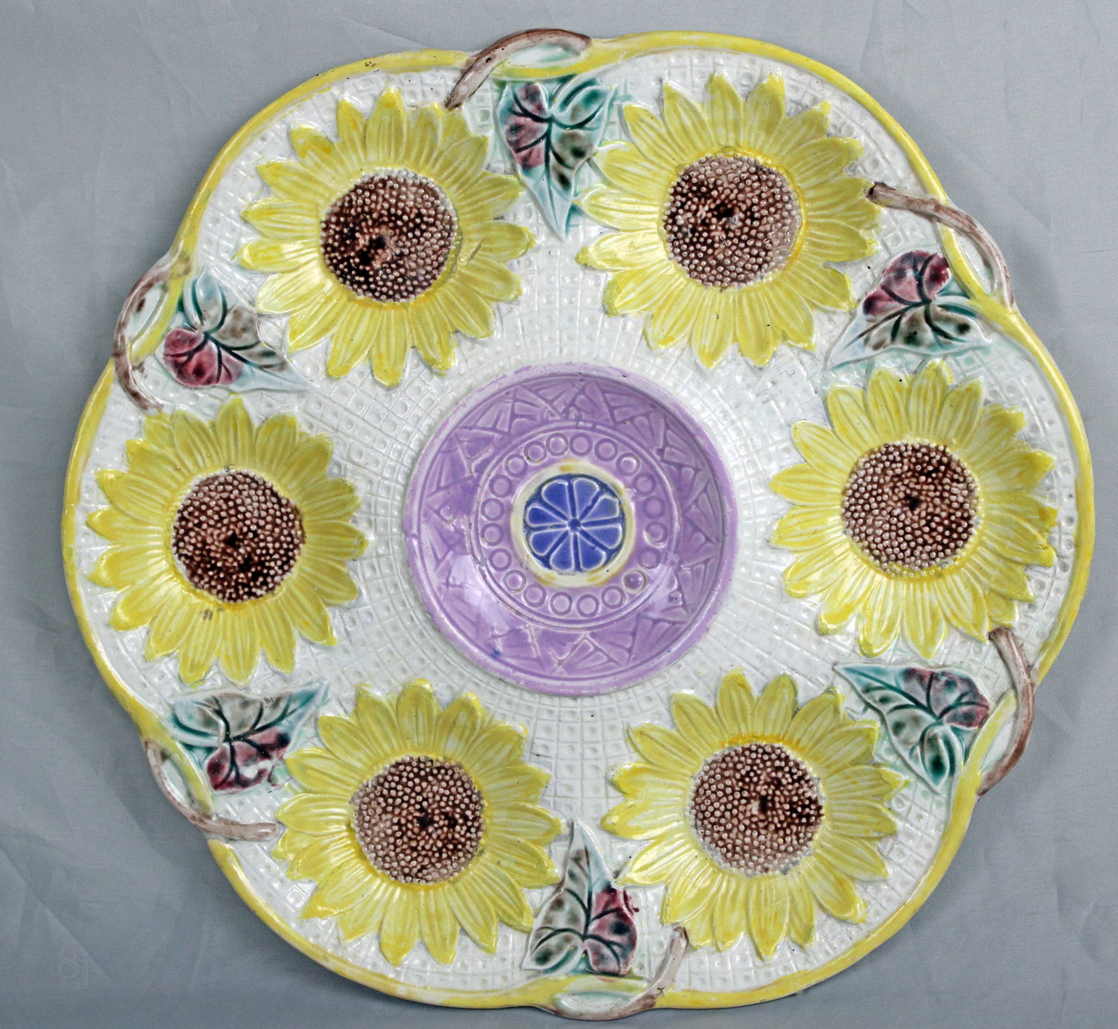 Samuel Lear 6 well majolica sunflower: oyster plate with central purple glazed center, impressed registration lozenge to rear, excellent color & condition 10"w. Ref: Majolica Mania vol.1 p115