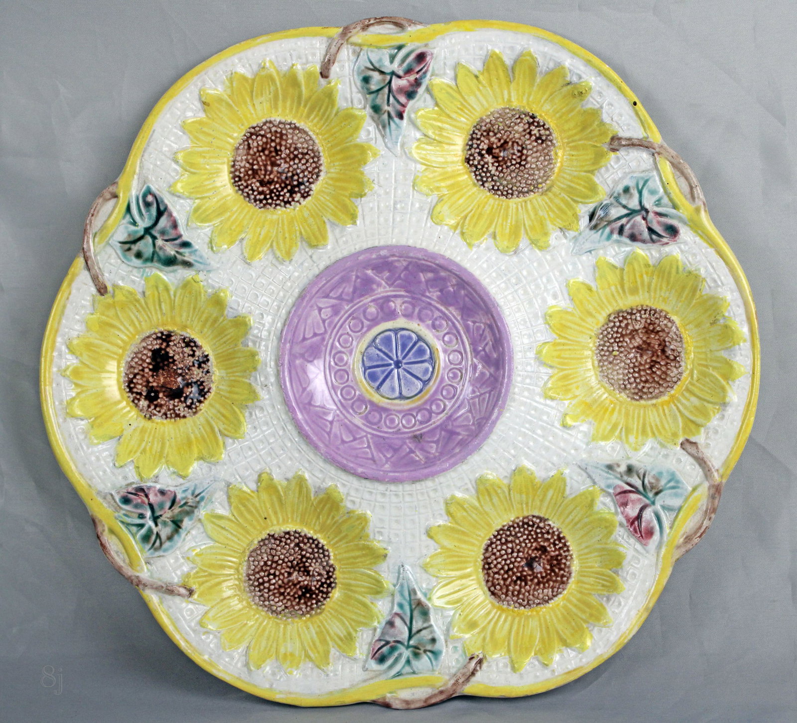 Samuel Lear 6 well majolica sunflower: oyster plate with central purple glazed center, impressed registration lozenge to rear, excellent color & condition 10"w. Ref: Majolica Mania vol.1 p115