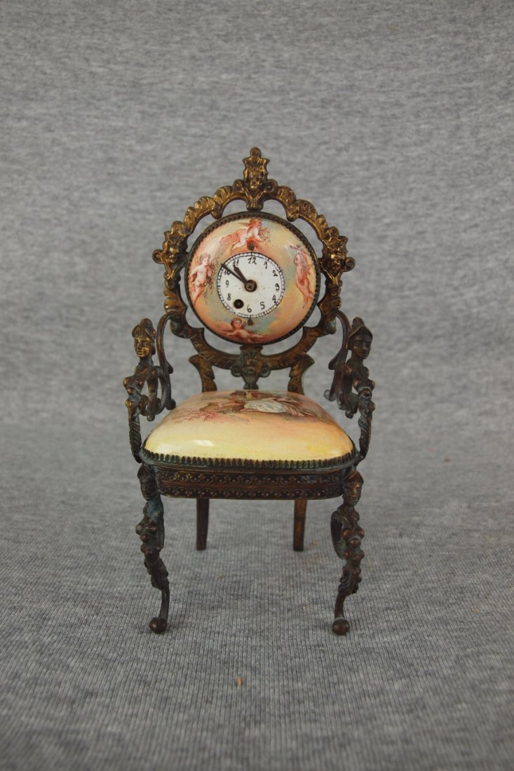 RARE Joseph Kostler, Wiel Austria 1704 bronze and: RARE Joseph Kostler, Wiel Austria 1704 bronze and enamel Fusee clock in the form of an arm chair with enamel back with angels and seat with romantic couple, highly ornate bronze chair frame with gothi