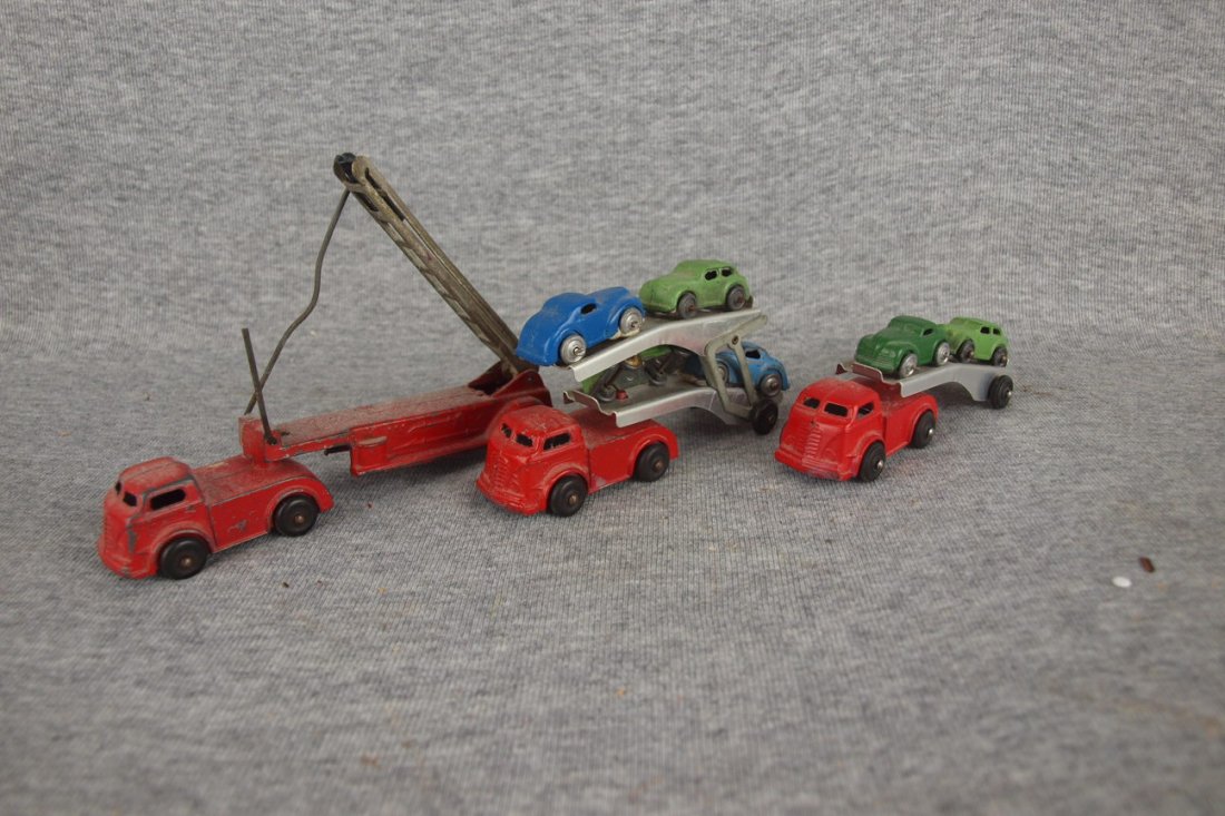 Lot of 3 small trucks - fire engine, car hauler with 4: Lot of 3 small trucks - fire engine, car hauler with 4 cars and car hauler with 2 cars