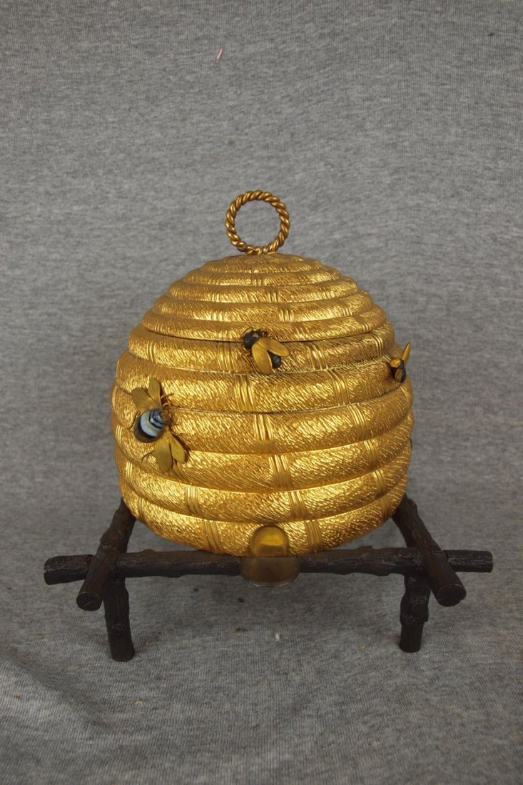 Howell & James London bronze and brass sewing box in: Howell & James London bronze and brass sewing box in the form of a bee hive with jeweled bee, blue linen lined interior, 9 1/2"