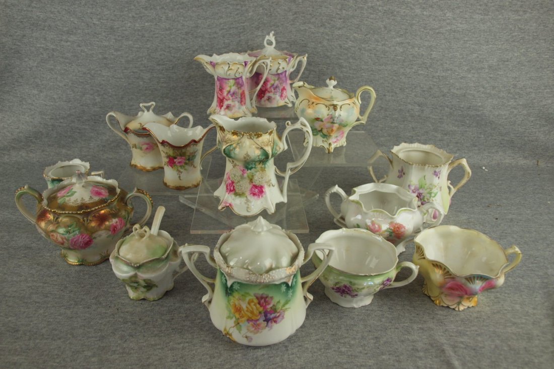 R.S. Prussia lot of 14 pieces - creamers, sugars, cups,: R.S. Prussia lot of 14 pieces - creamers, sugars, cups, mustard pots, some with nicks , 3 with no lids