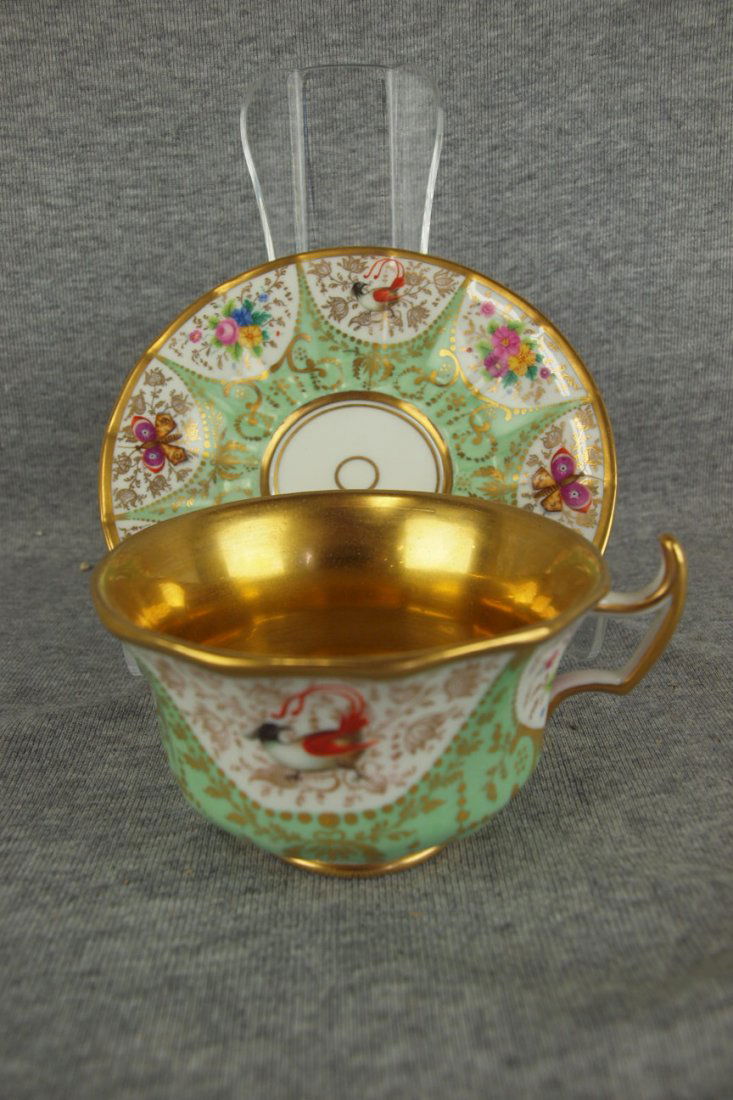 KPM porcelain cup and saucer with birds, butterflies: KPM porcelain cup and saucer with birds, butterflies and flowers