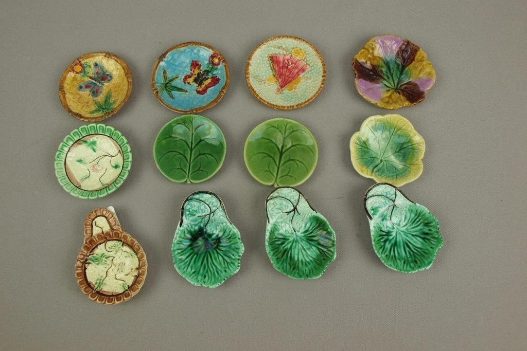 Majolica lot of 12 butter pats , various condition: Majolica lot of 12 butter pats , various condition