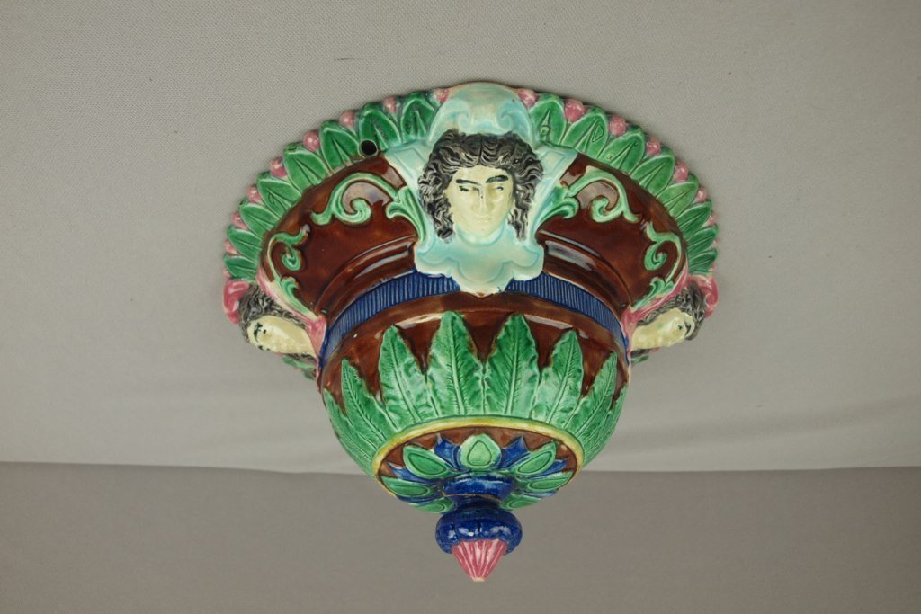 Majolica hangning jardiniere with ladies heads, repair: Majolica hangning jardiniere with ladies heads, repair to base finial, 10"d, 6"h