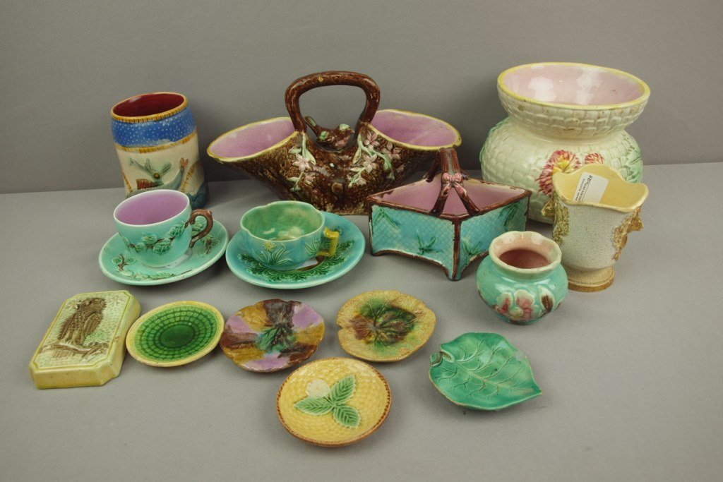 Majolica lot of 14 pieces - spittoon, 2 baskets, 2 cups: Majolica lot of 14 pieces - spittoon, 2 baskets, 2 cups & saucers, 3 vases, 5 butter pats and owl paperweight, various condition