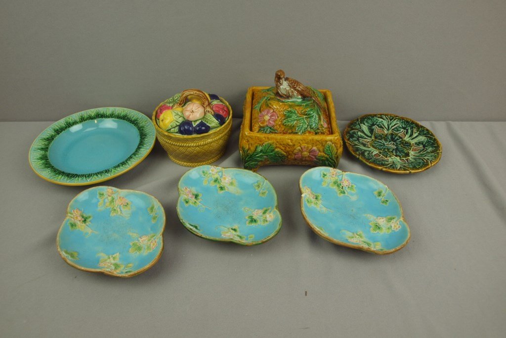 Majolica lot of 7 pieces - 3 George Jones strawberry: Majolica lot of 7 pieces - 3 George Jones strawberry floral sauce dishes, wear; George Jones turquoise wheat bowl; water lily plate, fruit basket and contemporary sardine box with bird