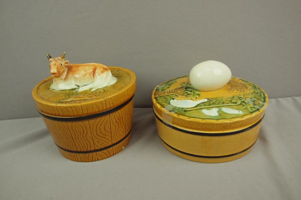 Majolica lot of 2 Continental covered dishes, one with: Majolica lot of 2 Continental covered dishes, one with a cow the other with an egg, various condition