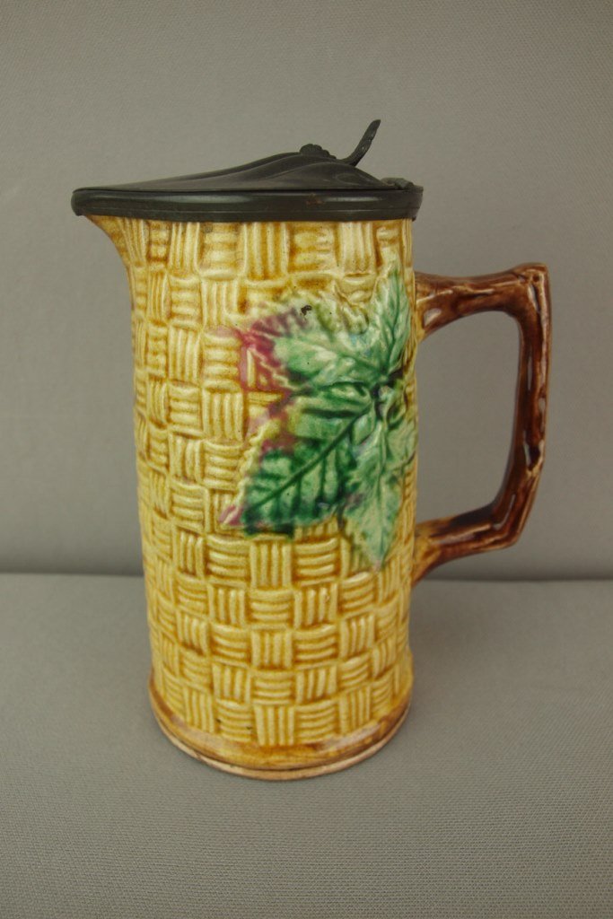 Majolica basketweave and leaf syrup pitcher with pewter: Majolica basketweave and leaf syrup pitcher with pewter top, 6 1/2"