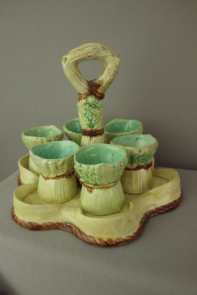 Majolica egg cup holder with 6 sheaves of wheat egg: Majolica egg cup holder with 6 sheaves of wheat egg cups, unusual form, 7"h