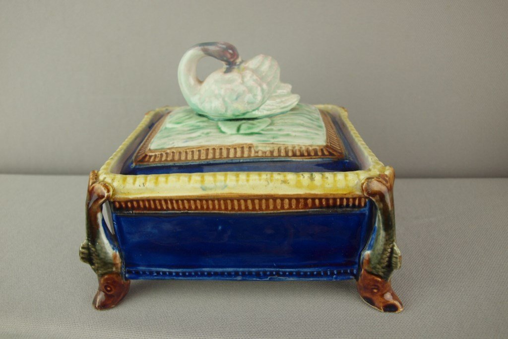 Majolica cobalt sardine box with fish corners and swan: Majolica cobalt sardine box with fish corners and swan on lid, repair to lid corner