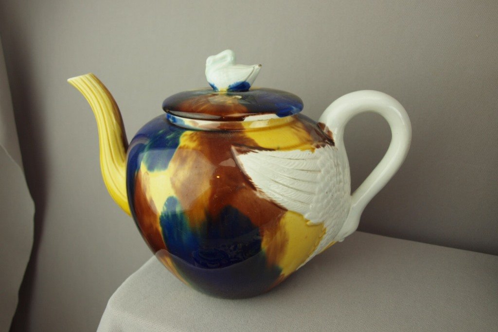 Bevington (attributed) majolica teapot with swan handle: Bevington (attributed) majolica teapot with swan handle and finial, chip to spout and lid rim, rare form, 6 1/2"h