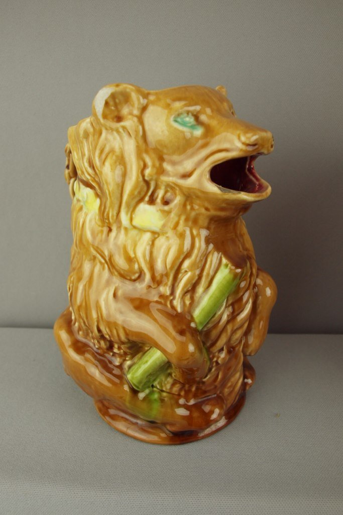 French majolica figural pitcher of a bear with stick,: French majolica figural pitcher of a bear with stick, ref: Cunningham p. 141, 8 1/2" , chip to ear
