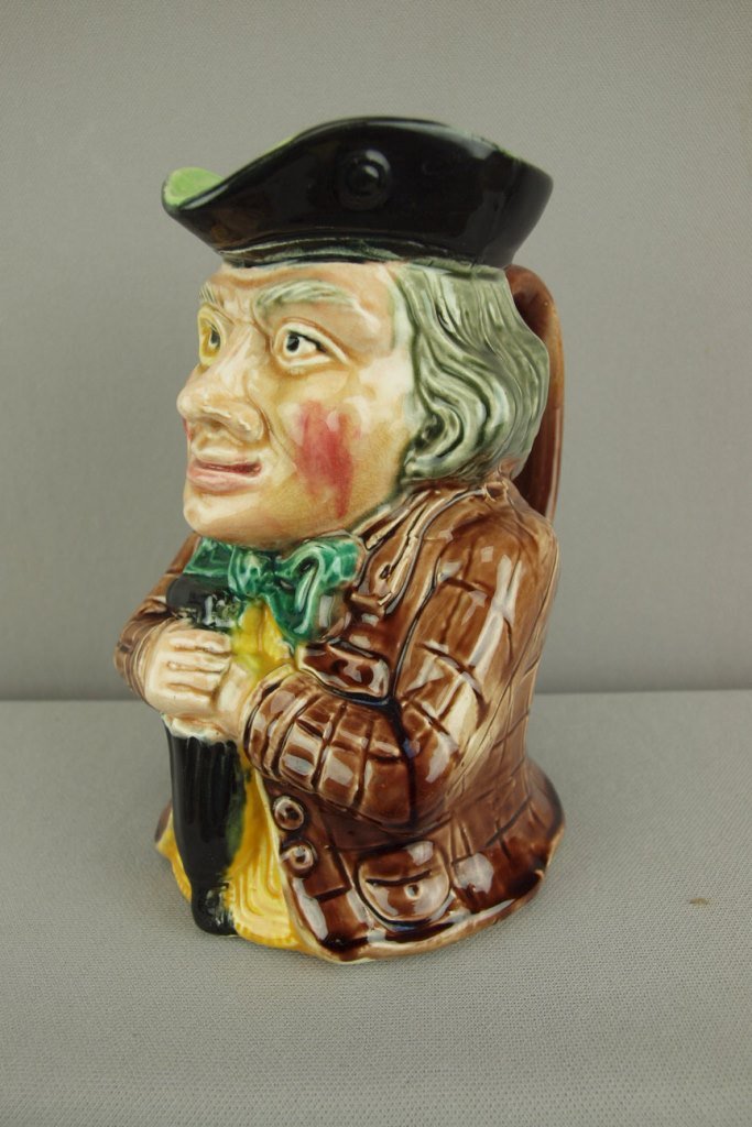 Majolica figural toby jug of man with umbrella, 7 1/4": Majolica figural toby jug of man with umbrella, 7 1/4"