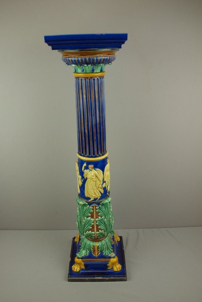 Gustavsberg tall majolica pedestal cobalt ground and: Gustavsberg tall majolica pedestal cobalt ground and figures in relief, chips to base, 37"