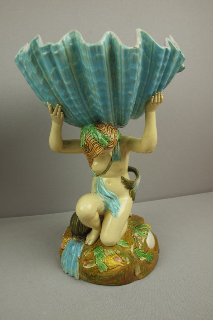 GEORGE JONES majolica table center in the form of Venus: GEORGE JONES majolica table center in the form of Venus with dolphin support large shell on rock base, 16", minor rim chip to shell