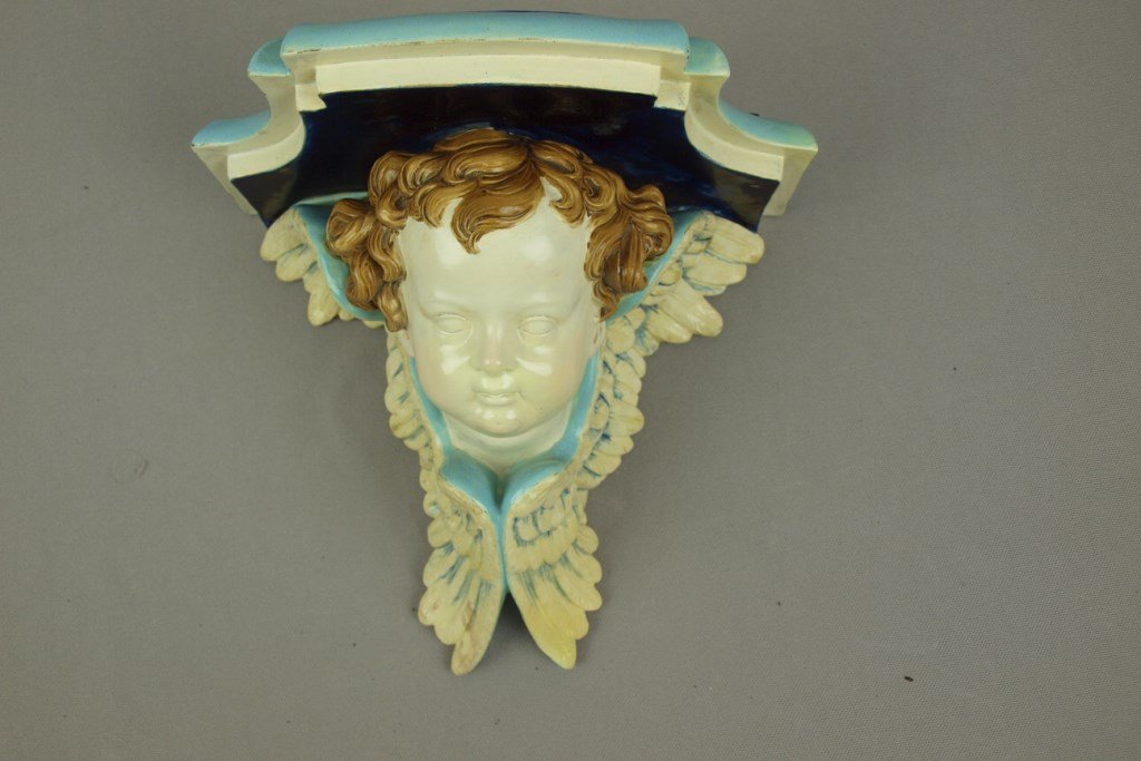 ROYAL WORCESTER rare majolica bracket shelf with winged: ROYAL WORCESTER rare majolica bracket shelf with winged putti, 9"h, 9 3/4"w, professional repair to wing tip