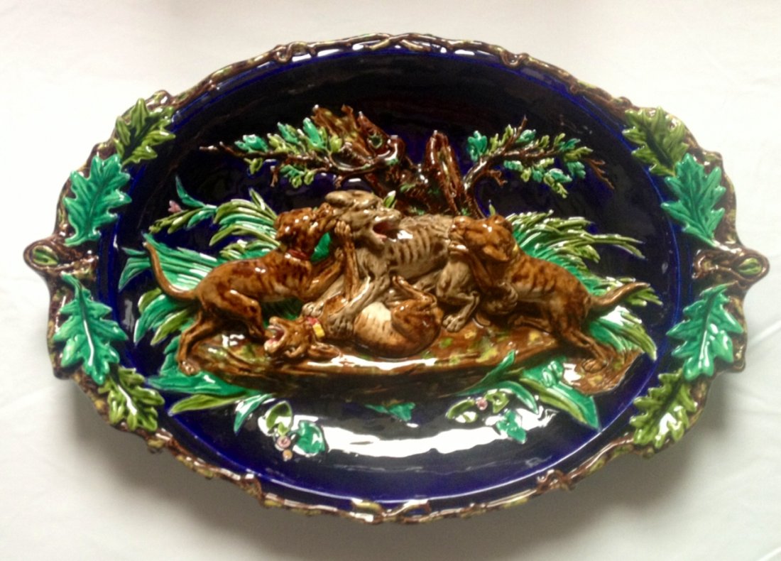 SARREGUEMINES majolica monumental wall platter with: SARREGUEMINES majolica monumental wall platter with dogs attacking wolf, circa 1880, shape no. 592, rare form , 24"l