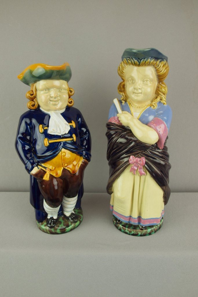 MINTON majolica pair of toby jugs of Barrister, 11": MINTON majolica pair of toby jugs of Barrister, 11" shape no. 1140 and Lady, 11 1/2", shape no. 1139, professional repair to rim, ref: Karmason- Stacke p. 62