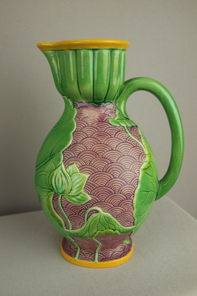 MINTON majolica Japanese style jug with lily leaves and: MINTON majolica Japanese style jug with lily leaves and vine handle, 8", hairline