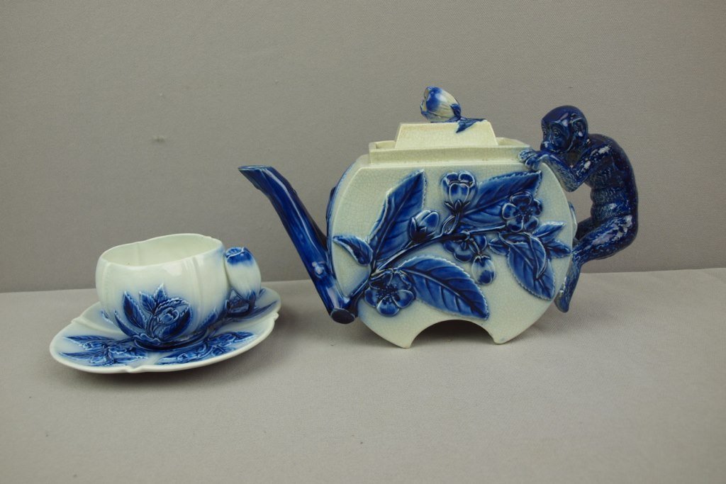 GEORGE JONES blue and white teapot with monkey handle: GEORGE JONES blue and white teapot with monkey handle and floral motif with matching cup and saucer, professional spout repair