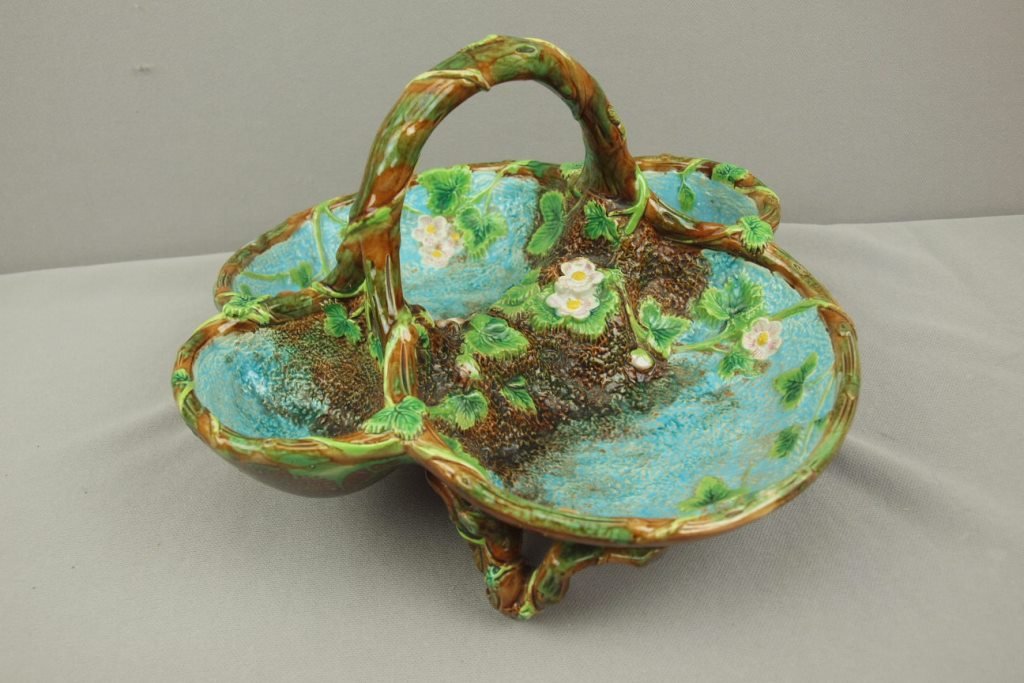 GEORGE JONES majolica four part strawberry basket with: GEORGE JONES majolica four part strawberry basket with vine handle and feet, 7 1/2"h, 11 1/2"w