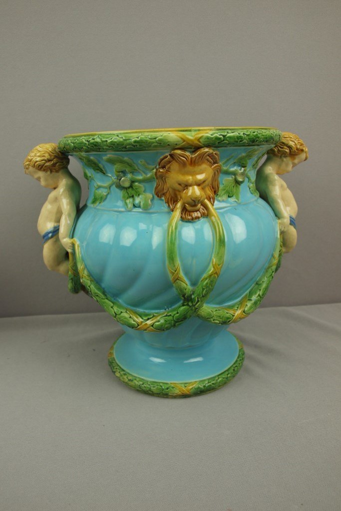 MINTON majolica wine cooler with two putti handles with: MINTON majolica wine cooler with two putti handles with lion masks and laurel garlands , 10 1/2"h, 12"w