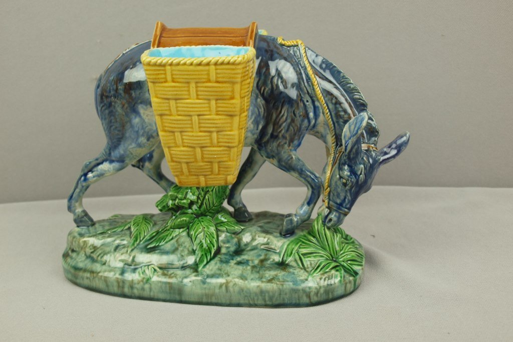 MINTON majolica sweet meat server in the form of a: MINTON majolica sweet meat server in the form of a donkey with two baskets, 7"h, 10"l, professional repair to donkey's ear