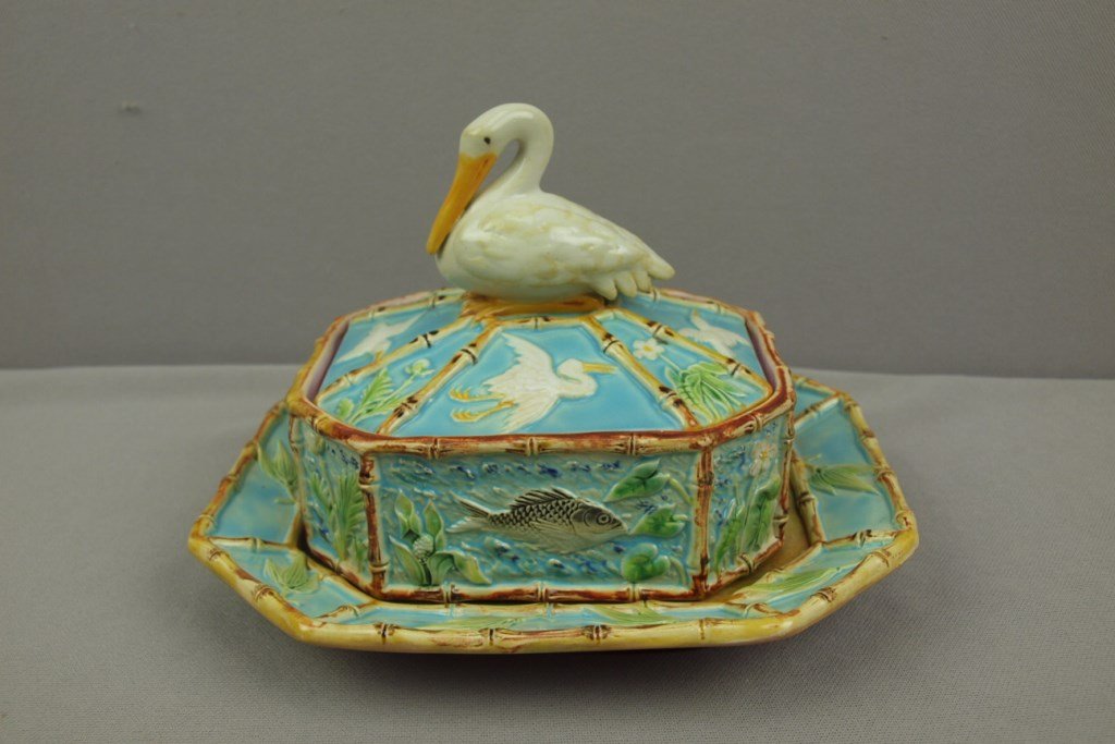 GEORGE JONES majolica sardine box and stand with: GEORGE JONES majolica sardine box and stand with pelican finial and bamboo trim, 8 1/2"l, 6"h, professional repair to pelican's neck and lid rim