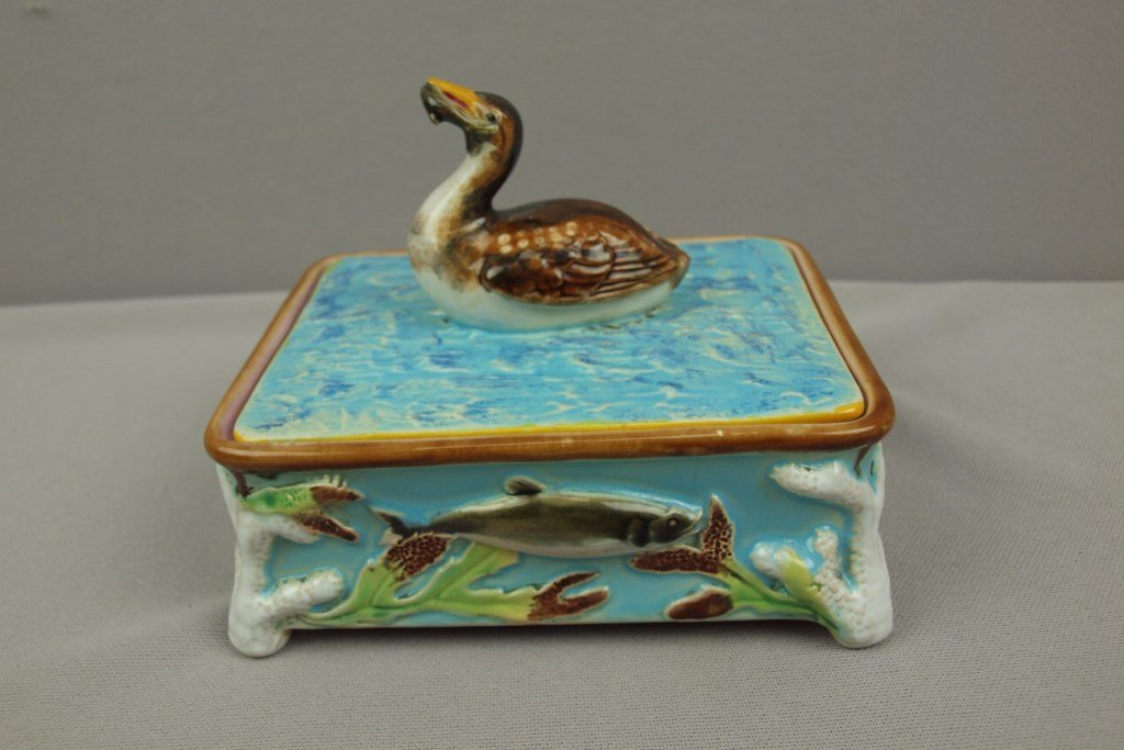 GEORGE JONES majolica sardine box with duck with fish: GEORGE JONES majolica sardine box with duck with fish on cover, fish in high relief on base with coral corners, 6"l