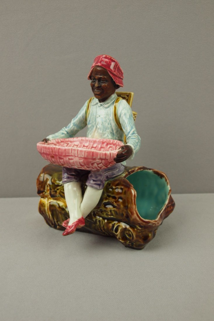 Majolica Blackamoor man seated on log w/ baskets match: Majolica Blackamoor man seated on log w/ baskets match striker, 7"