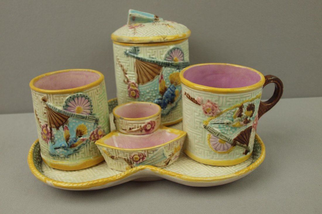 Majolica bird and fan 5 piece smoking set with tray,: Majolica bird and fan 5 piece smoking set with tray, humidor, cigarette holder, match striker and mug, minor hairline to mug