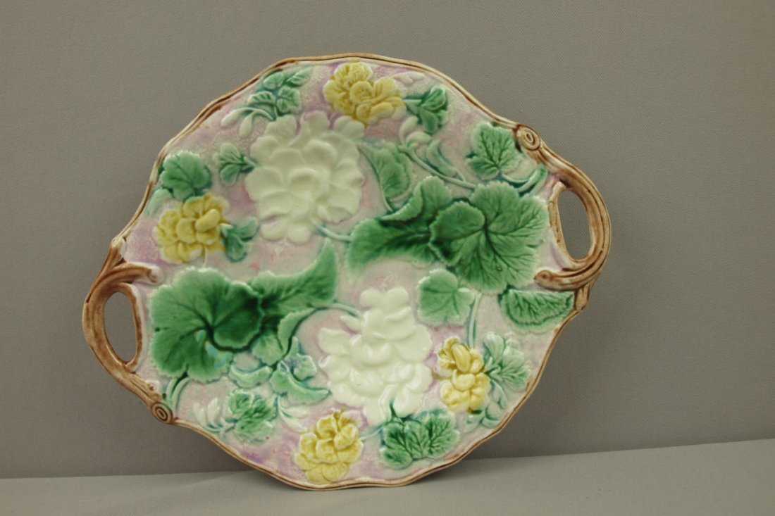 Etruscan Majolica geranium platter with rare pink: Etruscan Majolica geranium platter with rare pink background, 12", rim chip to back