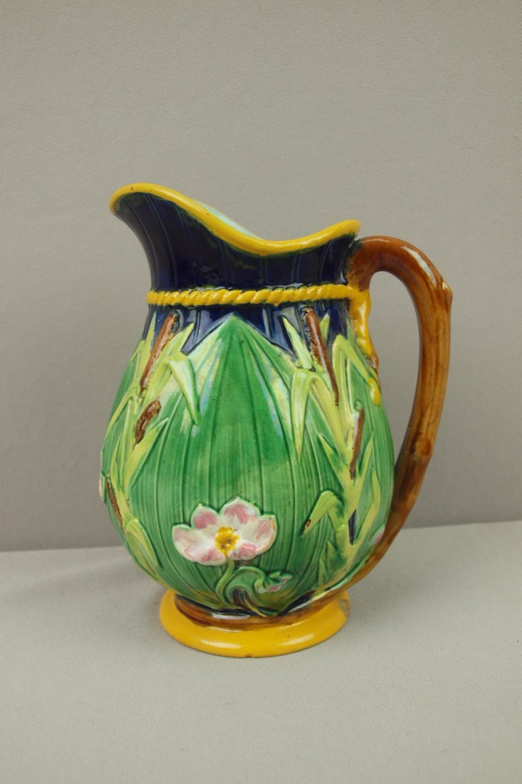 George Jones cattail & water lily Majolica pitcher with: George Jones cattail & water lily Majolica pitcher with cobalt ground, 7 1/2", rim chip, hairline